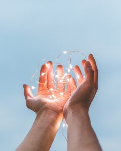 Two Hands Holding Lights