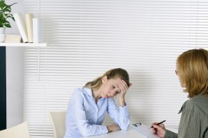 Woman Stressed Talking to Doctor